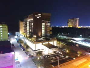 A multi-story hotel with a prominent sign reading "The Vista Hotel." - The Vista Hotel (Sadao)