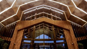 A modern building with a geometric wooden facade and large windows. - Lin Yin Art Hotel Shanghai PVG Airport Disneyland Free Shuttle (Shanghai)