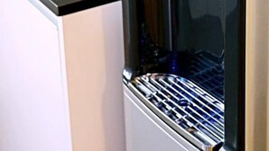 A kitchen with a built-in water dispenser and a sink. - Dreamcatchers Home (Kuantan)
