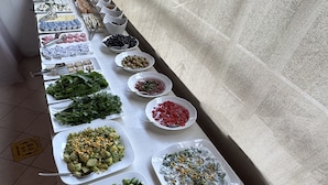 A buffet table with various food items including fruits, vegetables, and salads. - Mimosa Pension (Kas)