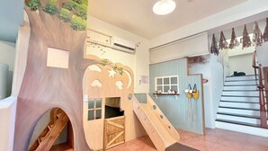 A play area with a slide, a treehouse, and a staircase. - Village Villa B&B (Zhuqi)