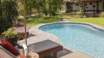 Outdoor pool, pool umbrellas, pool loungers