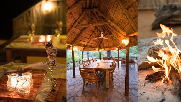 A dining area with a thatched roof, stone flooring, and a fire pit. - Ku Sungula Safari Lodge (Hoedspruit)