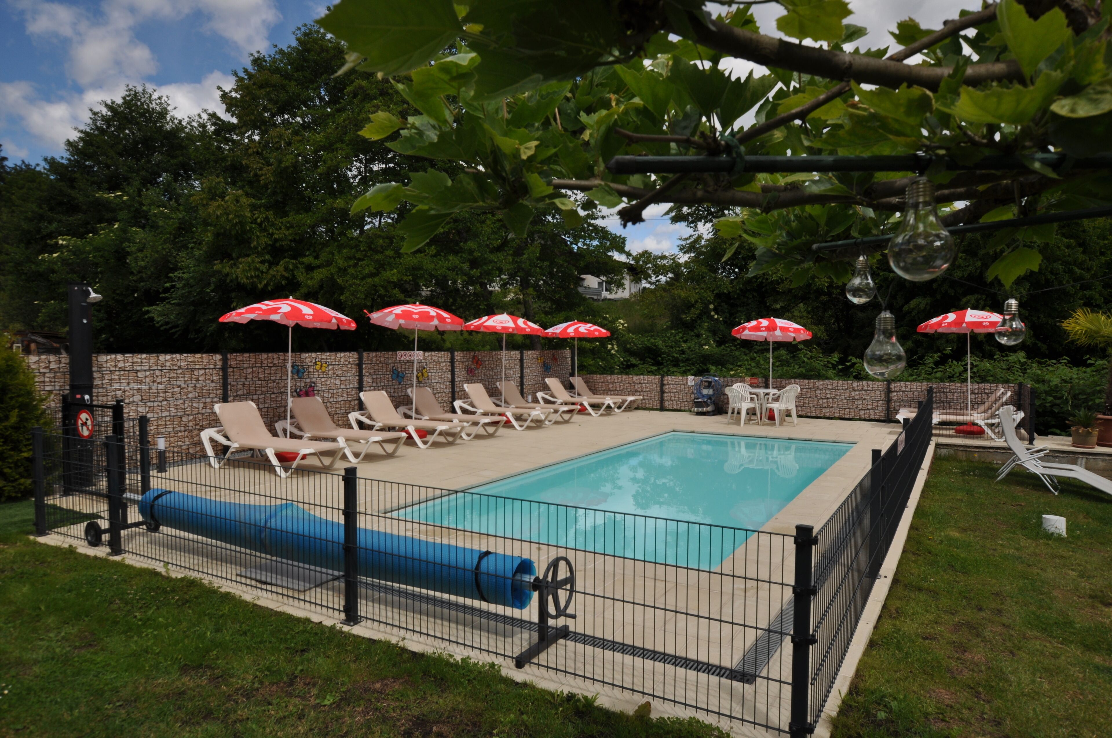 Seasonal outdoor pool, open 9:00 AM to 6:00 PM, pool umbrellas