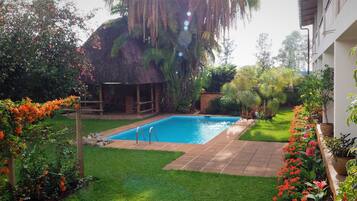 Outdoor pool, pool umbrellas, sun loungers