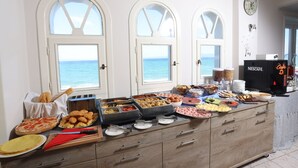 A buffet table with various food items and a coffee machine. - Summer Beach Hotel (Kassandra)