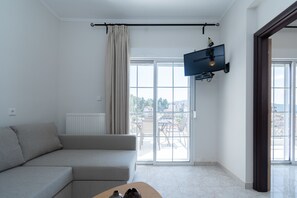 Superior Apartment, Sea View | Living area | 28-inch flat-screen TV with satellite channels, LCD TV