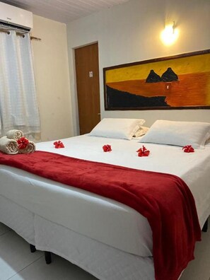 Quarto quádruplo standard | Frigobar, roupa de cama