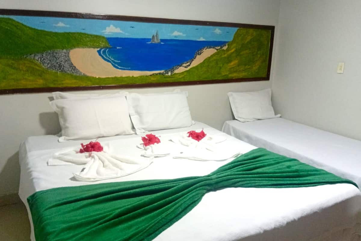 Standard Triple Room, Ground Floor | Minibar, bed sheets