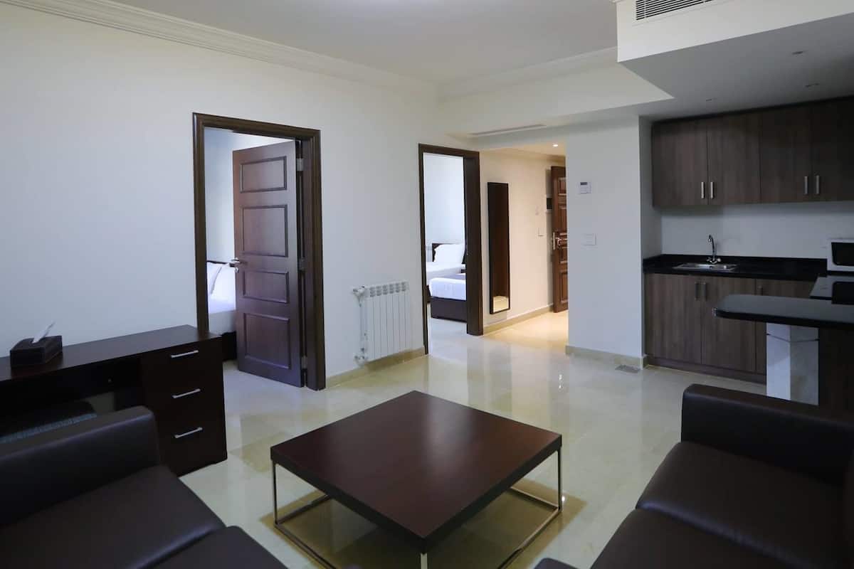 family suite, 2 bedrooms | living area | lcd tv
