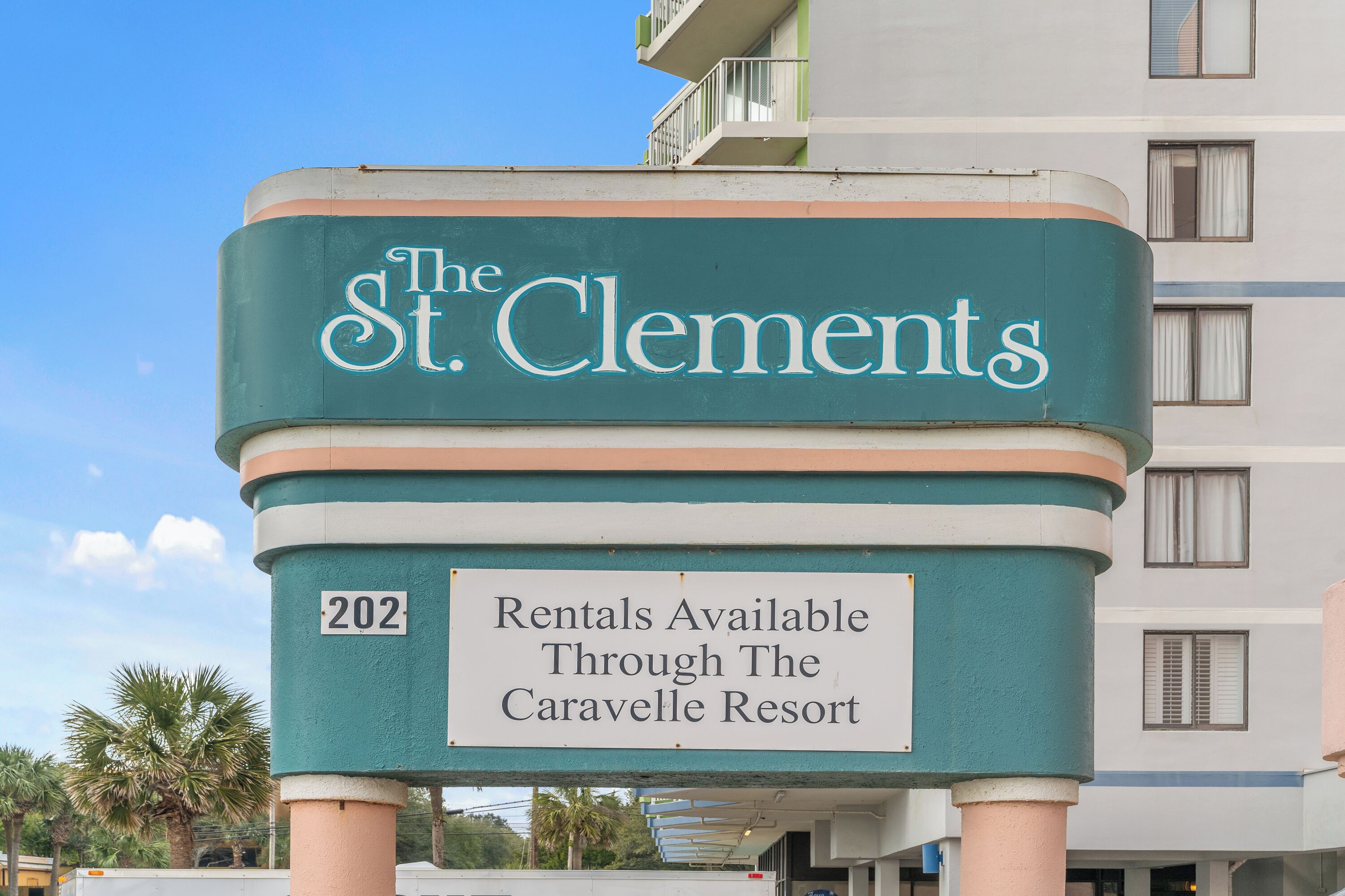 A sign for The St. Clement's with a rental availability notice for The Caravelle Resort.