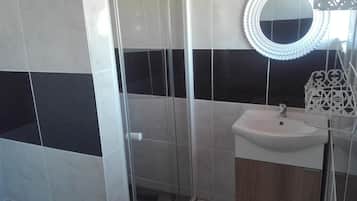 Shower, deep soaking tub, free toiletries, hair dryer