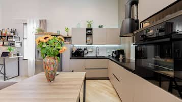 Superior Loft, 1 Bedroom | Private kitchen | Coffee/tea maker, electric kettle, cleaning supplies