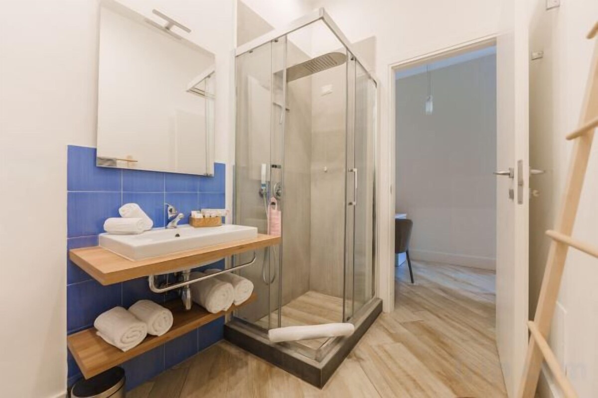 Bathroom | Shower, rainfall showerhead, eco-friendly toiletries, hair dryer