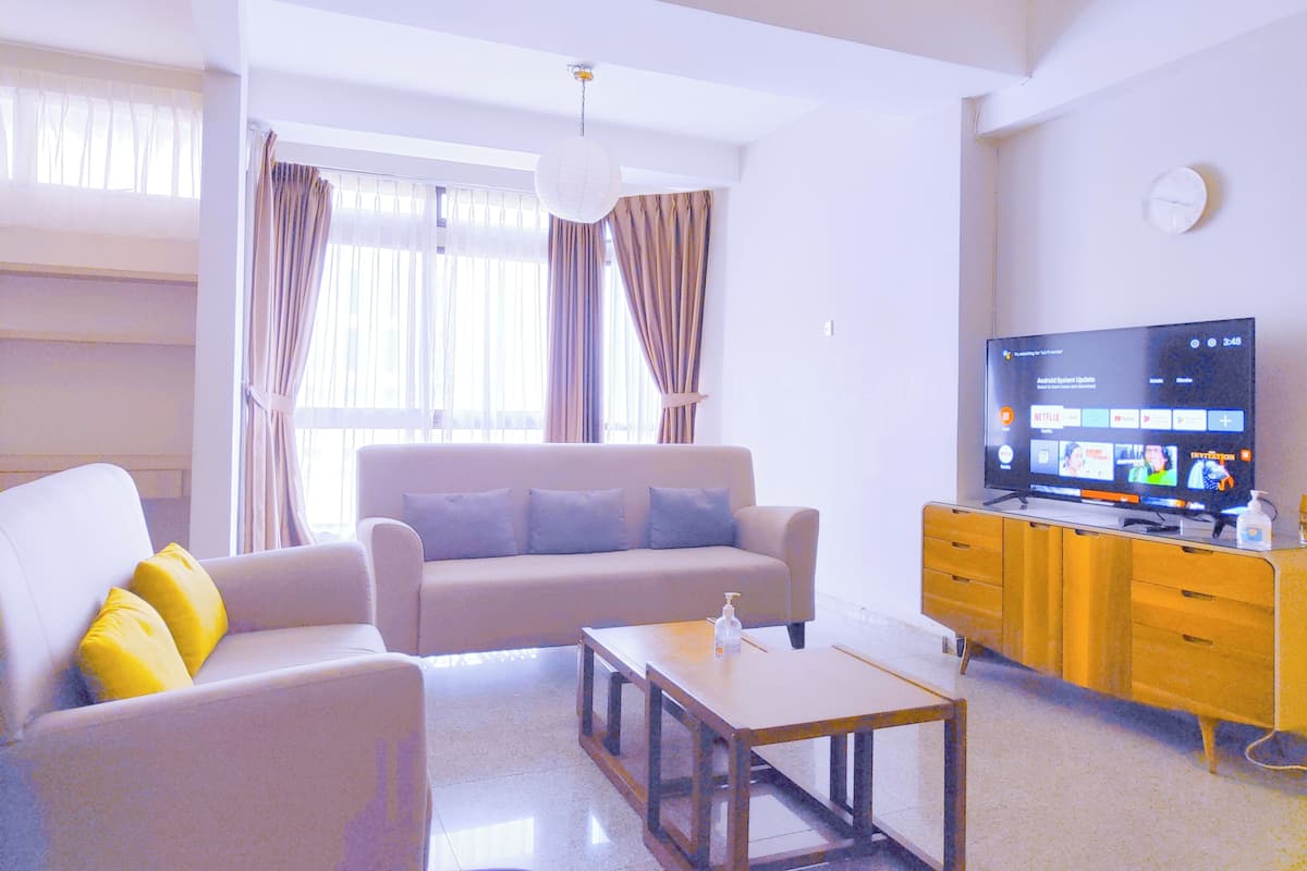 Design Apartment | Living area | Flat-screen TV