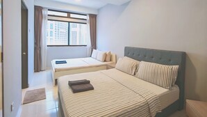 A hotel room with a large bed, a smaller bed, a window with curtains, a ceiling light, and a tiled floor. - Pavilion Fahrenheit 88 - AJ home (Kuala Lumpur)