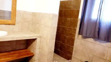 Deluxe Double Room, Garden View | Bathroom | Shower, free toiletries, slippers, towels