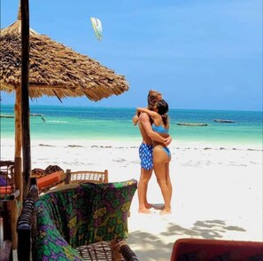 Private beach, white sand, beach shuttle, beach bar