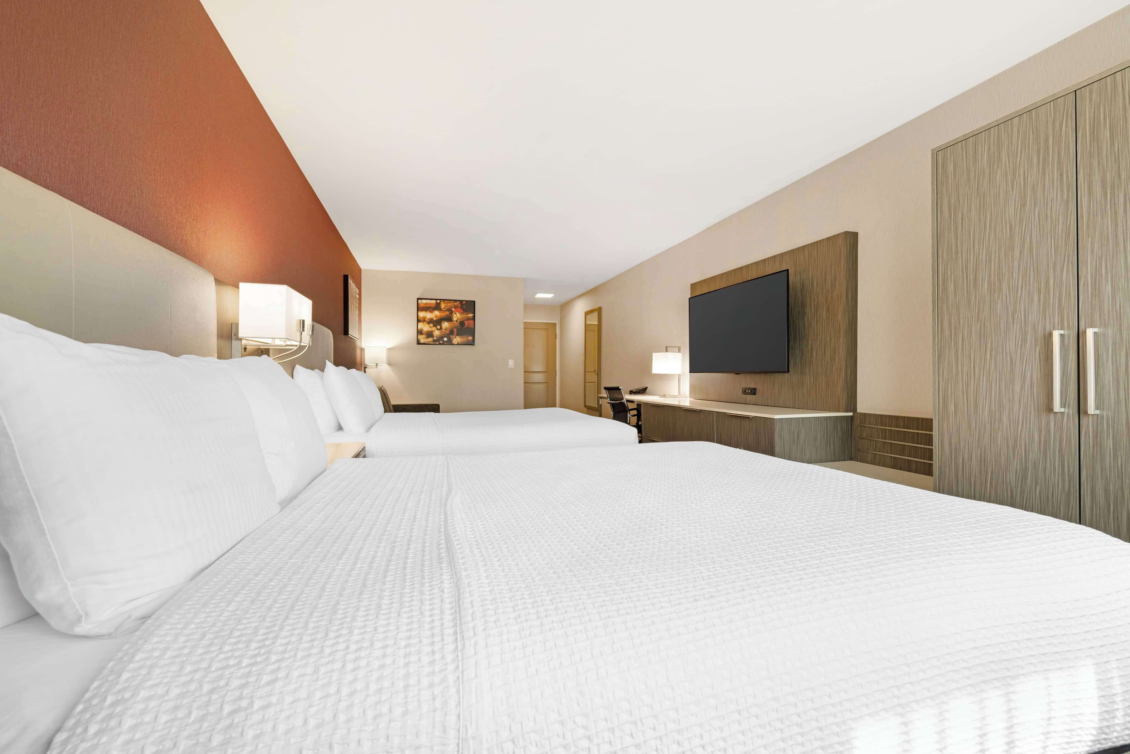 standard room, 2 queen beds, non smoking, refrigerator & microwave | pillow-top beds, in-room safe, desk, laptop workspace