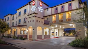 A hotel with a 'Best Western Plus' sign, multiple balconies, and a covered entrance area. - Best Western Plus Temecula Wine Country Hotel &Suites (Temecula)