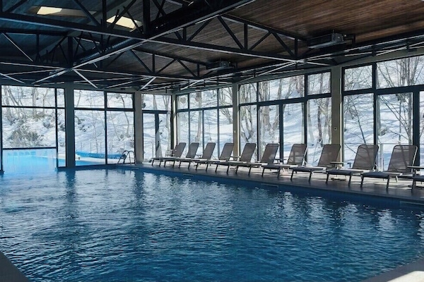 Indoor pool, outdoor pool, open noon to 7 PM, pool umbrellas
