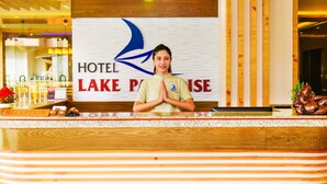 A hotel reception desk with a sign reading "HOTEL LAKE PARISE". - Hotel Lake Paradise (Pokhara)