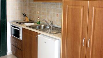 Studio, Sea View | Private kitchenette | Fridge, stovetop, electric kettle, cookware/dishes/utensils