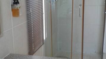 Separate tub and shower, deep soaking tub, free toiletries, towels