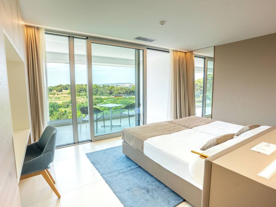 Apartment, 1 Bedroom, Balcony, Sea View | 1 bedroom, in-room safe, desk, soundproofing