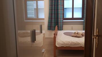 Premium bedding, desk, laptop workspace, free WiFi