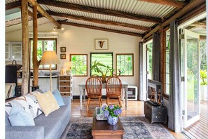 Romantic Cabin, 1 Bedroom, Bathtub, Garden View | Living area | Flat-screen TV, DVD player