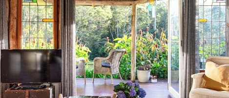 Romantic Cabin, 1 Bedroom, Bathtub, Garden View | Living area | Flat-screen TV, DVD player