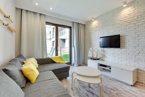Apartment, 1 Bedroom, Garden View (without parking - 74) | Living area | Flat-screen TV - Apartinfo Aura Island Apartments (Gdansk)