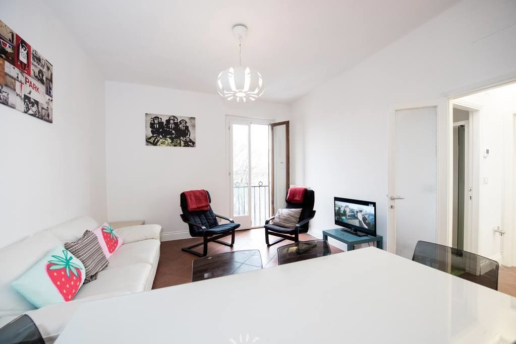 Basic Apartment, 3 Bedrooms | Living room | Flat-screen TV