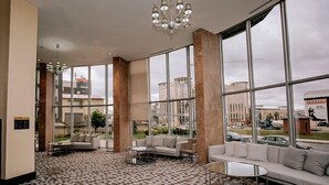 A spacious lobby with large windows, a checkered floor, and modern furniture. - KONAK PARK HOTEL (Yomra)