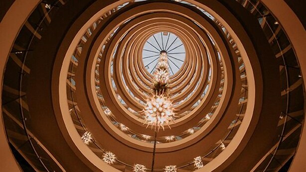 A multi-level atrium with a central chandelier and circular architectural design. - KONAK PARK HOTEL (Yomra)