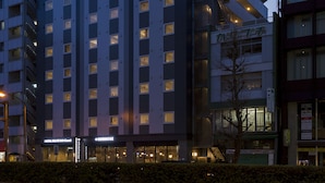 A multi-story hotel with a prominent sign reading "HOTEL ROUTE INN" at the top. - Hotel Route-Inn Grand Tokyo Asakusabashi (Tokyo)