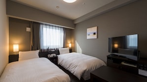A hotel room with two beds, a TV, a desk, and a window with curtains. - Hotel Route-Inn Grand Tokyo Asakusabashi (Tokyo)