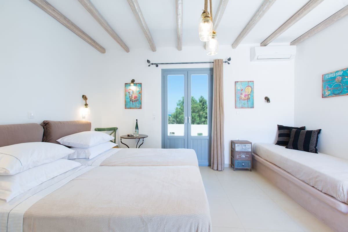 Chambre Triple Deluxe, vue mer | Coffres-forts dans les chambres, chambres insonorisées