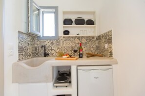 Fridge, stovetop, highchair, cookware/dishes/utensils