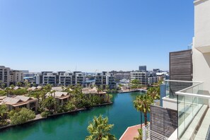 A high-rise building with a view of a marina and surrounding buildings. - 606 Juliette B (Cape Town)