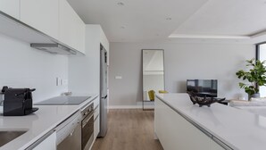 Apartment | Private kitchen | Coffee/tea maker, full-size fridge, microwave, oven