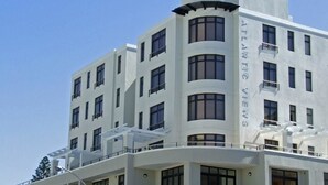A multi-story building with balconies and large windows, labeled "ATLANTIS VIEJO." - Atlantic Views 5 (Cape Town)