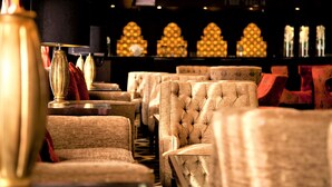 A row of plush, tufted chairs in a dimly lit room with ornate wall sconces and a patterned carpet. - Steigenberger Legacy Nile Cruise - Every Monday 07 & 04 Nights from Luxor - Every Friday 03 Nights from Aswan (Luxor)
