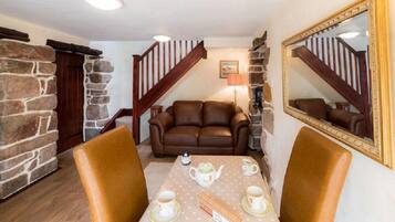 Luxury Cottage, 1 Bedroom, Mountain View, Mountainside | Living area | Flat-screen TV