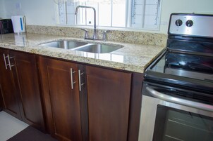 Family Villa, 2 Bedrooms, Non Smoking, Garden View | Private kitchen | Full-size fridge, microwave, oven, stovetop