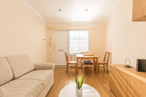 Apartment, 1 Bedroom | Living area | TV