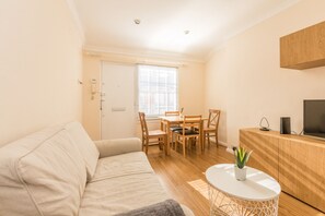 Apartment, 1 Bedroom | Living room | TV