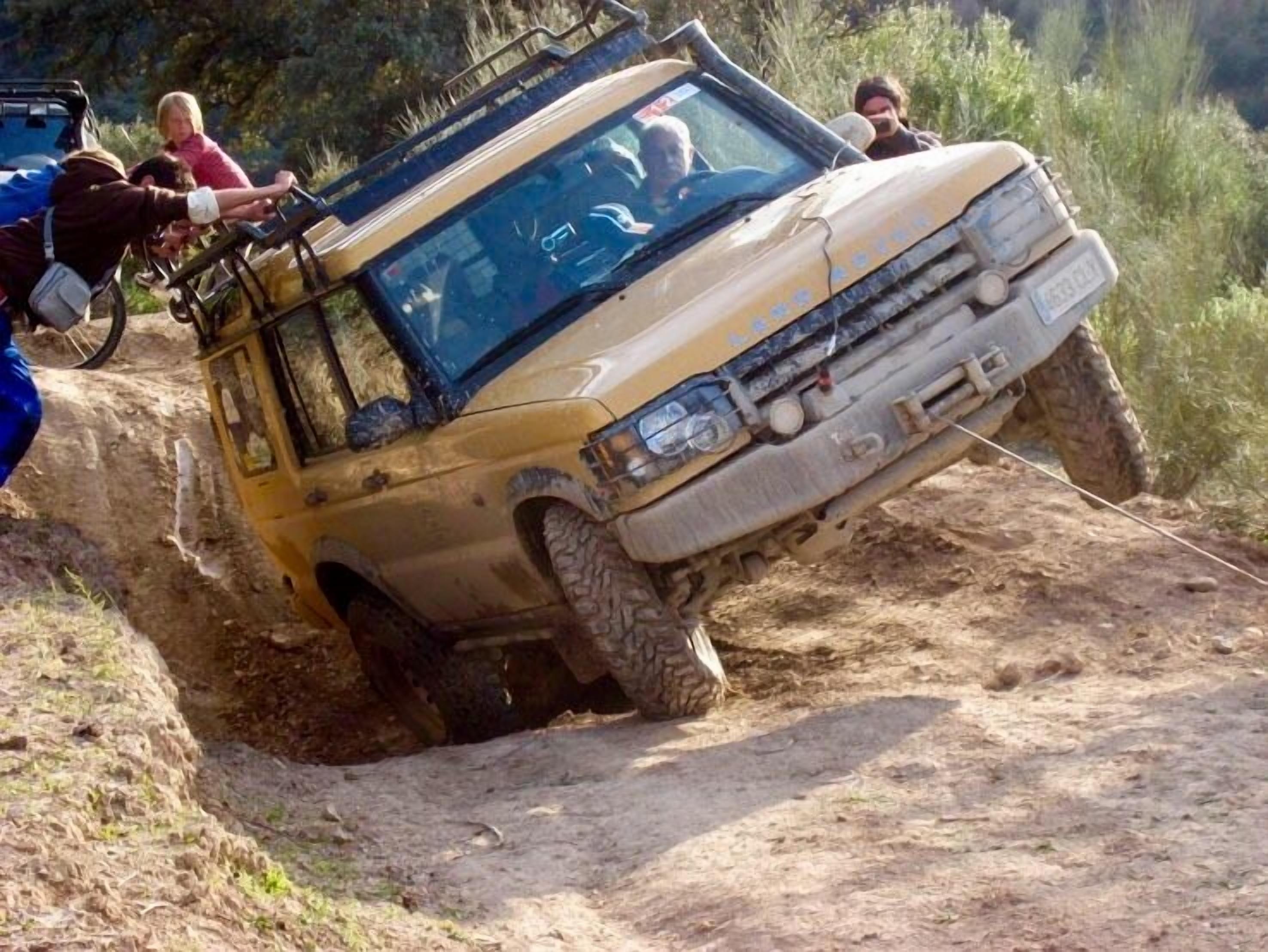 A vehicle stuck in a ditch.