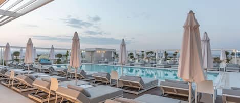Seasonal outdoor pool, open 9 AM to 7:00 PM, free pool cabanas